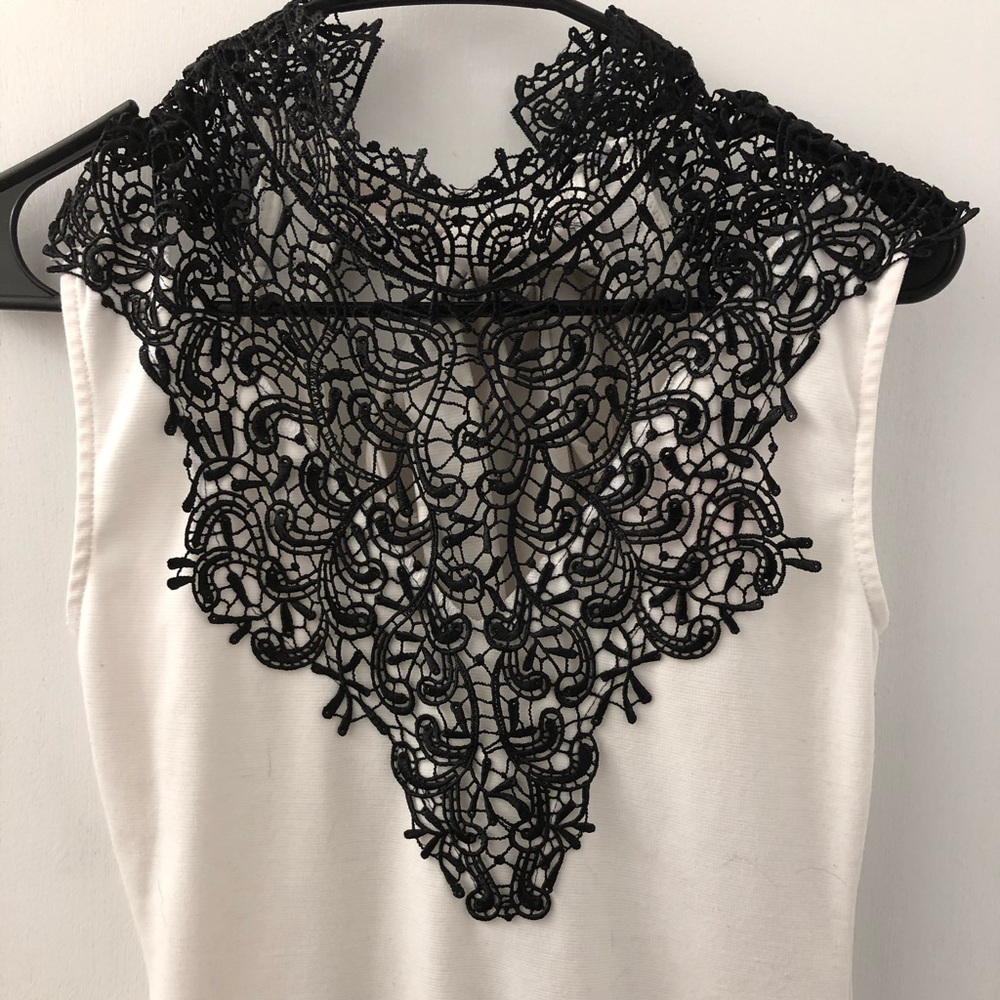 White dress with black lace neck detail